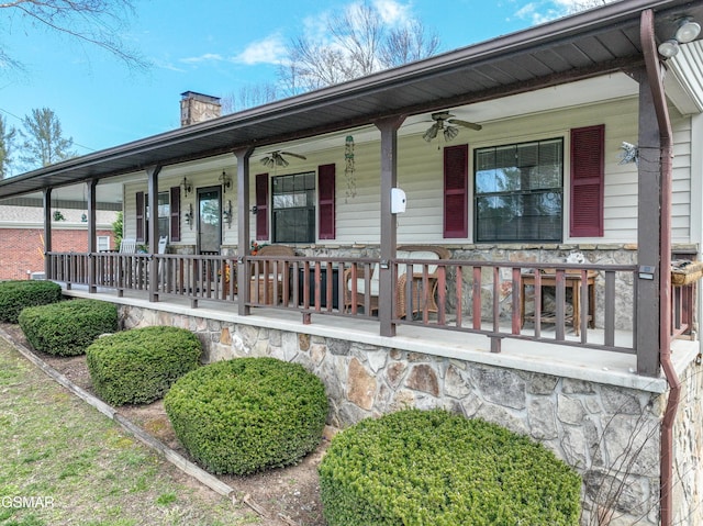 311 E Chestnut Hill Rd, Townsend, TN 37882 - view of front of house with stone siding, covered porch, a chimney, and a ceiling fan