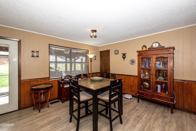 311 E Chestnut Hill Rd, Townsend, TN 37882 - dining area with light wood-style flooring, plenty of natural light, and a textured ceiling