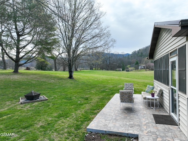311 E Chestnut Hill Rd, Townsend, TN 37882 - view of yard featuring an outdoor fire pit and a patio area