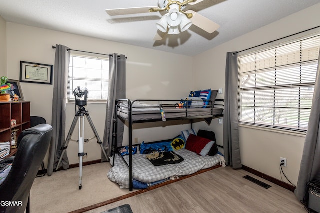 311 E Chestnut Hill Rd, Townsend, TN 37882 - bedroom with baseboards, visible vents, wood finished floors, and ceiling fan