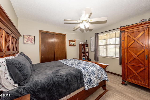 311 E Chestnut Hill Rd, Townsend, TN 37882 - bedroom featuring a closet, a textured ceiling, light wood-style floors, and ceiling fan