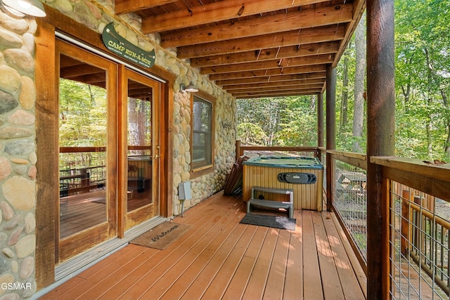 deck featuring an indoor hot tub