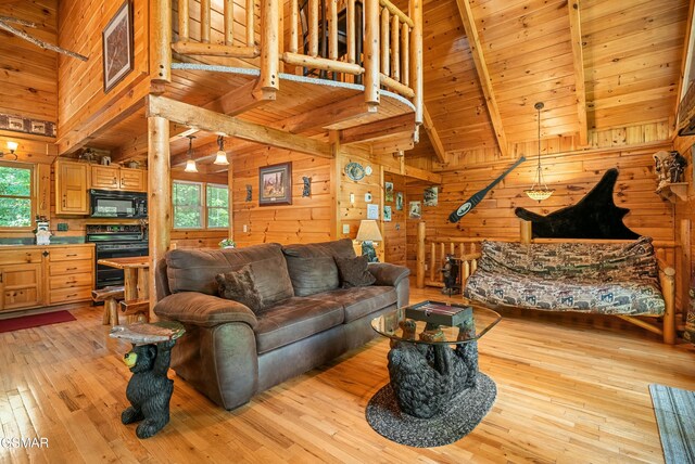 living area with wooden ceiling, wood walls, and light wood-style flooring