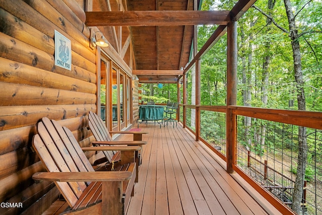 deck with outdoor dining area