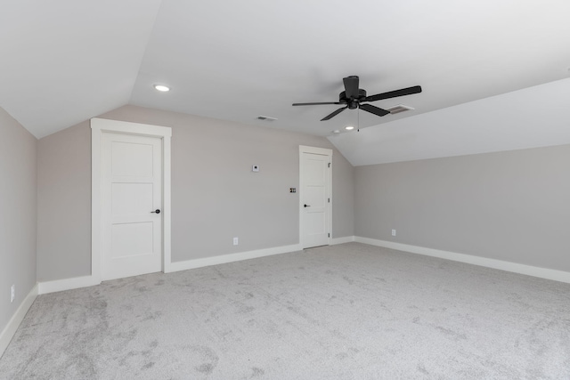 additional living space featuring ceiling fan, light carpet, and lofted ceiling