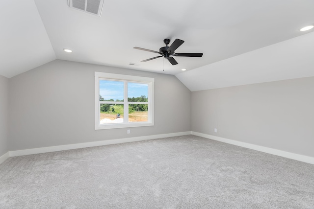 additional living space with lofted ceiling, ceiling fan, and carpet flooring