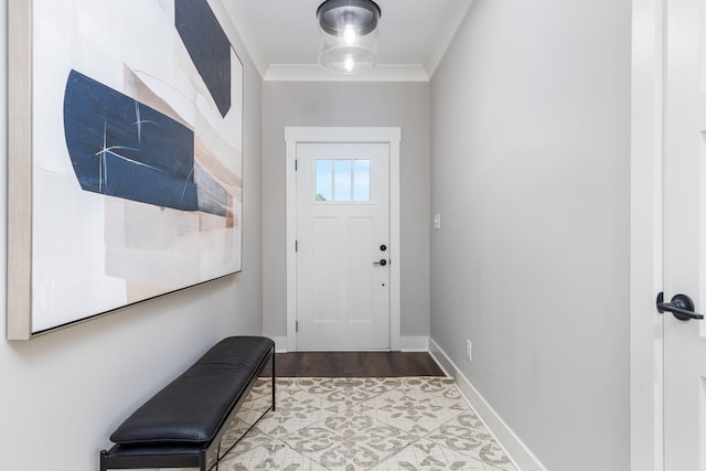 entryway featuring ornamental molding and light hardwood / wood-style flooring