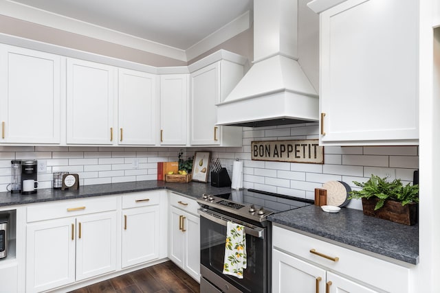 kitchen featuring backsplash, custom exhaust hood, electric range, white cabinets, and dark hardwood / wood-style flooring