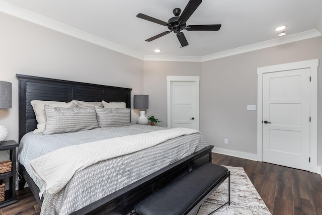 bedroom featuring ceiling fan, crown molding, and dark hardwood / wood-style floors