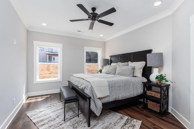 bedroom with ceiling fan, dark hardwood / wood-style flooring, and ornamental molding