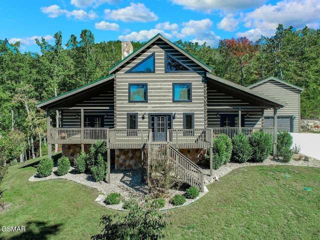 back of house with a lawn and a wooden deck