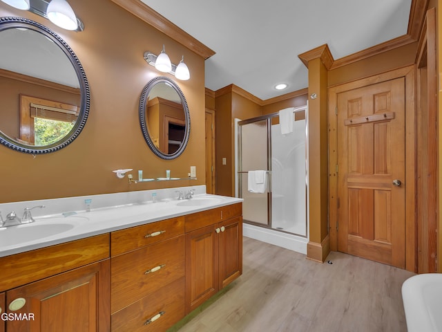 3541 Twin Pines Way, Sevierville, TN 37876 - bathroom with wood finished floors, a stall shower, crown molding, and double vanity