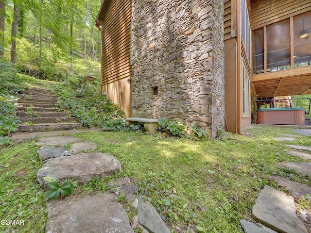 3541 Twin Pines Way, Sevierville, TN 37876 - view of property exterior featuring a sunroom and stone siding