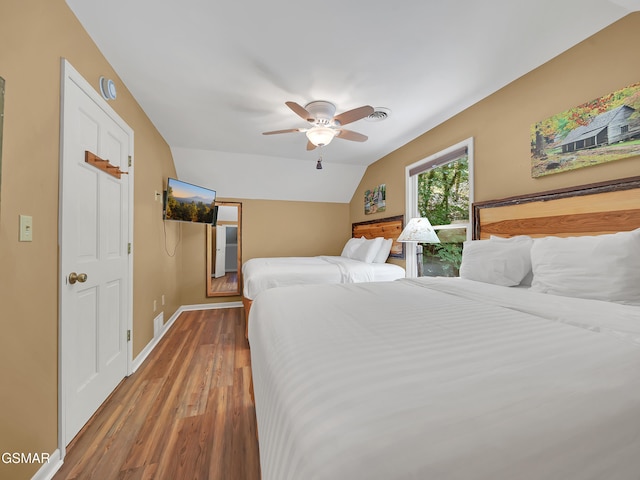 3541 Twin Pines Way, Sevierville, TN 37876 - bedroom featuring wood finished floors, vaulted ceiling, baseboards, and a ceiling fan