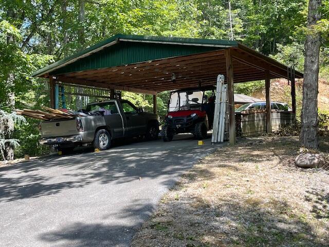 view of parking / parking lot with a carport