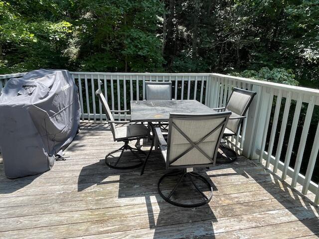 wooden deck featuring area for grilling