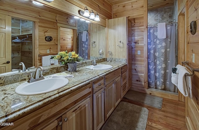 2422 Majestic View Way, Sevierville, TN 37862 - full bathroom with double vanity, wood walls, wood finished floors, and a shower with shower curtain
