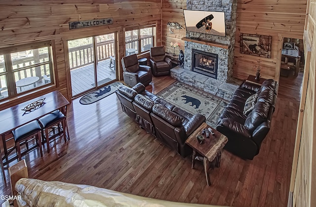 2422 Majestic View Way, Sevierville, TN 37862 - living room with wood walls, wood-type flooring, and a stone fireplace