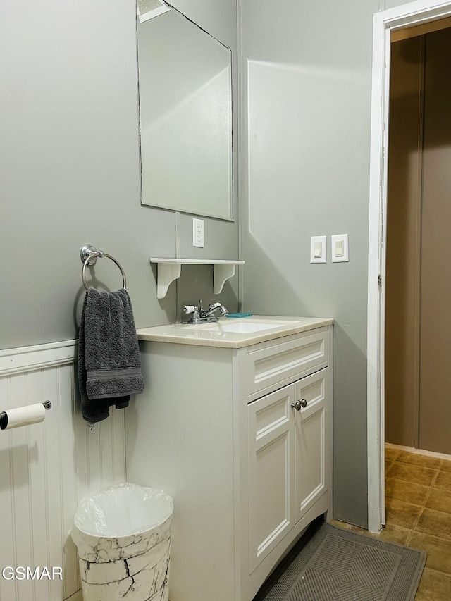 bathroom featuring vanity and wainscoting
