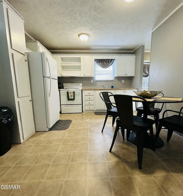 kitchen featuring white cabinetry, white appliances, light countertops, and open shelves