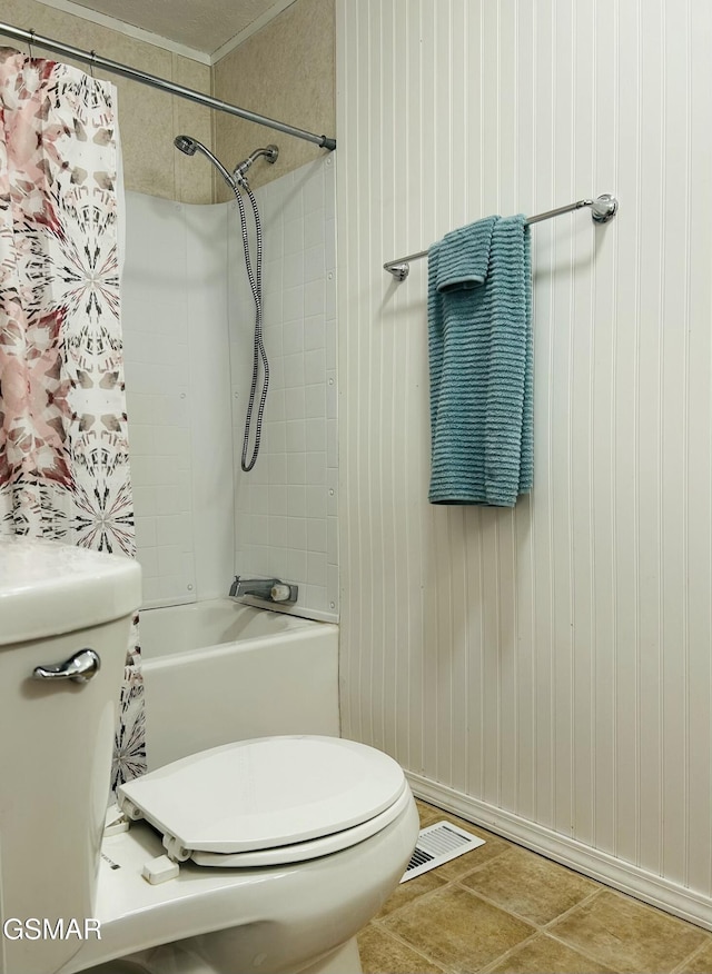 full bathroom with visible vents, shower / bath combo with shower curtain, and toilet
