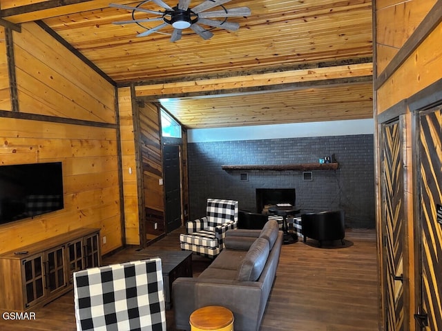 living area with wood ceiling, dark wood finished floors, wood walls, and ceiling fan