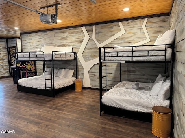 bedroom featuring wooden ceiling, a fireplace, dark wood-type flooring, and recessed lighting