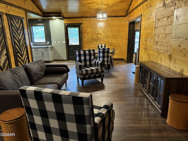 living area with wooden ceiling, dark wood-style floors, vaulted ceiling, and wood walls