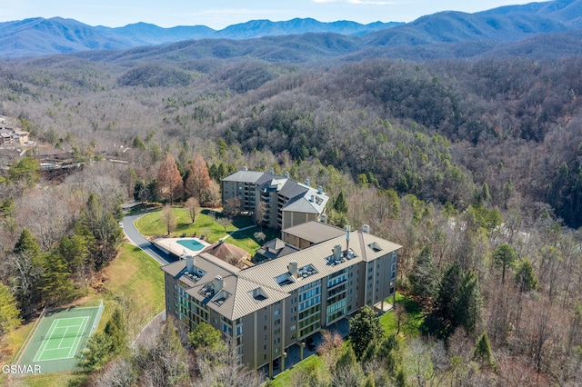 bird's eye view featuring a mountain view and a view of trees