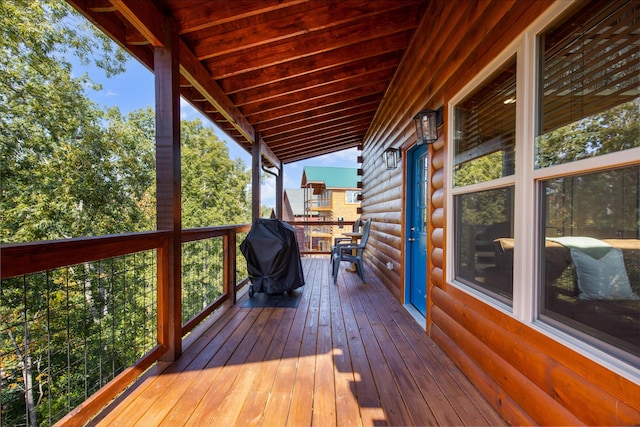 wooden terrace featuring a grill