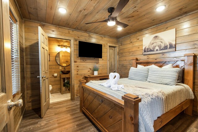 bedroom featuring wood-type flooring, ceiling fan, wooden ceiling, and wood walls