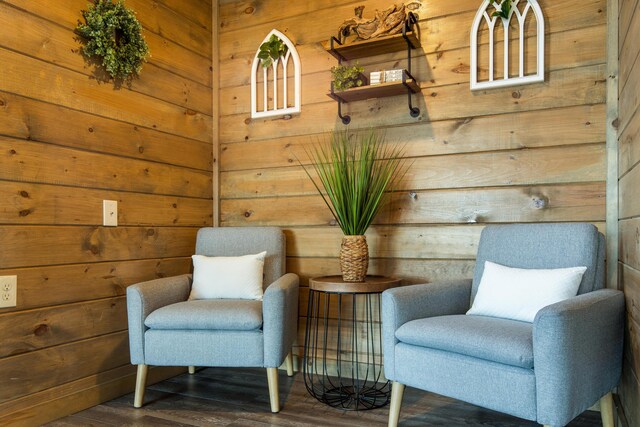 sitting room with dark hardwood / wood-style flooring