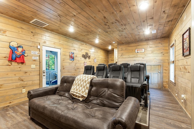 cinema room with wood ceiling, wood-type flooring, and wooden walls