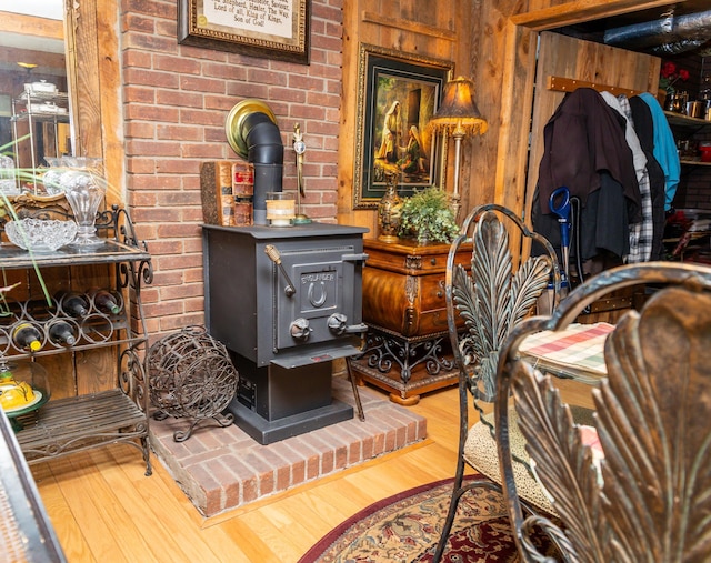 room details with wood-type flooring and a wood stove