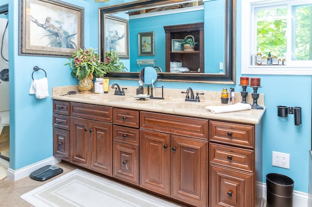 bathroom with tile patterned flooring and vanity