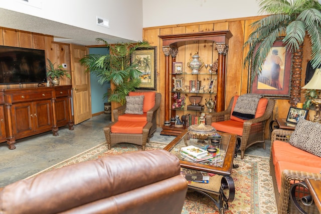 living room with wood walls