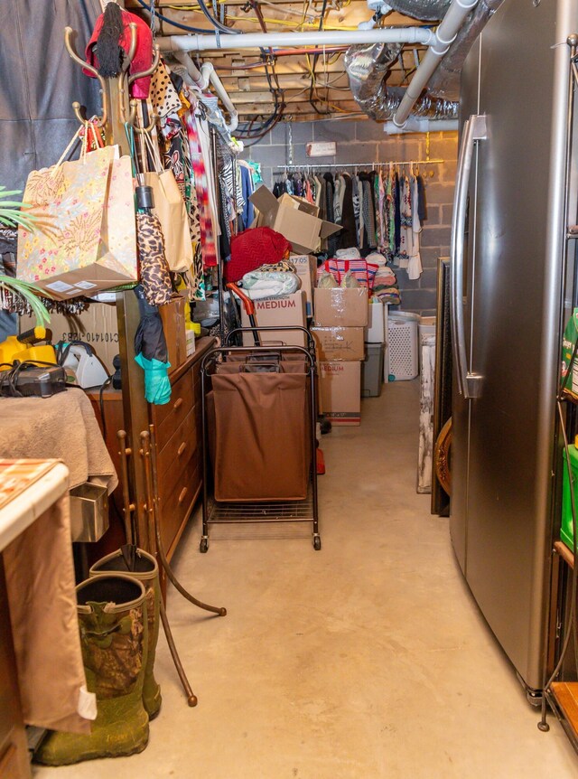 basement featuring stainless steel fridge