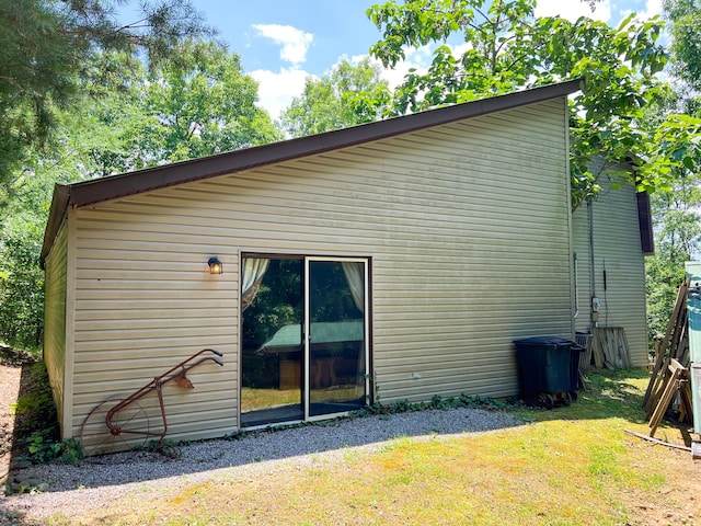 rear view of property with a yard