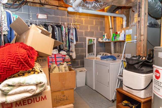 clothes washing area featuring washer and clothes dryer