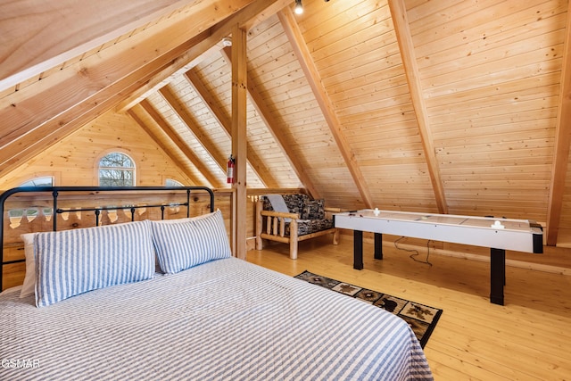 bedroom with wooden ceiling, wood-type flooring, lofted ceiling with beams, and wooden walls
