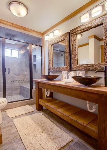 bathroom featuring ornamental molding, sink, hardwood / wood-style floors, toilet, and a shower with shower door