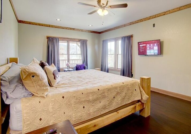 bedroom with ceiling fan, crown molding, and dark hardwood / wood-style floors