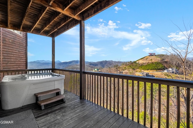 wooden deck featuring a mountain view