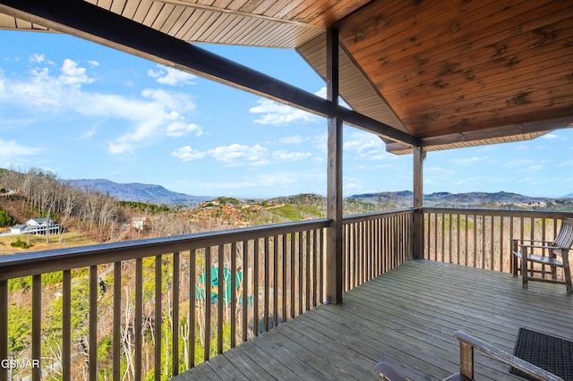 wooden deck with a mountain view