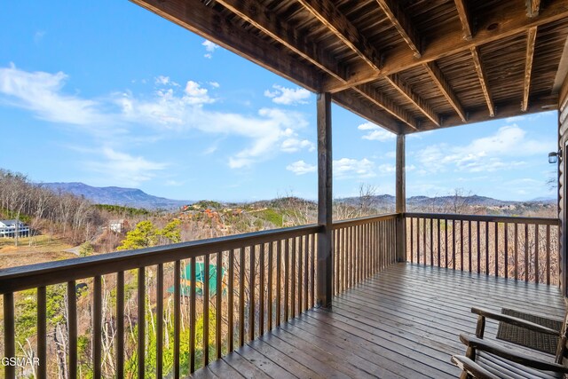 wooden deck featuring a mountain view