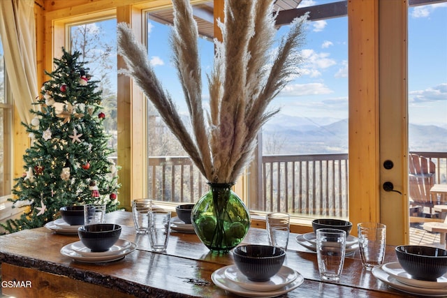 dining space with a mountain view and a wealth of natural light