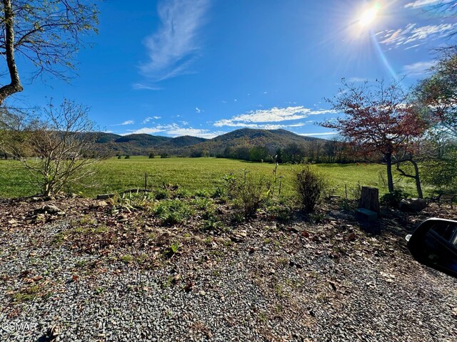 view of mountain feature with a rural view