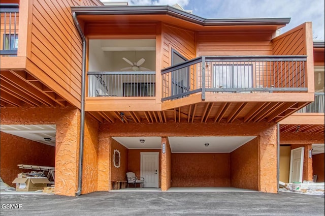 back of house featuring a balcony