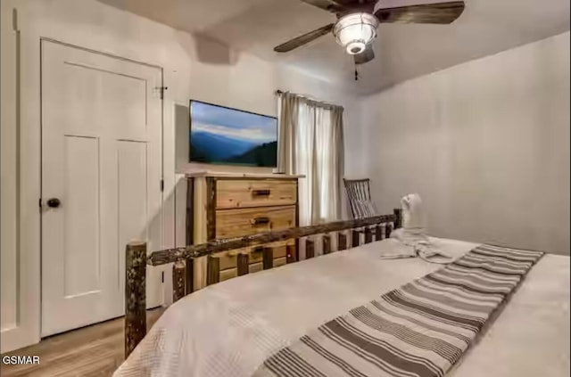 bedroom featuring ceiling fan and wood finished floors