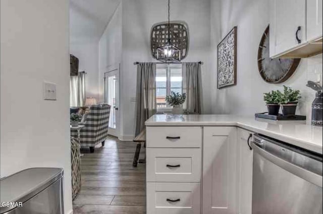 kitchen featuring light countertops, white cabinetry, wood finished floors, a chandelier, and dishwasher